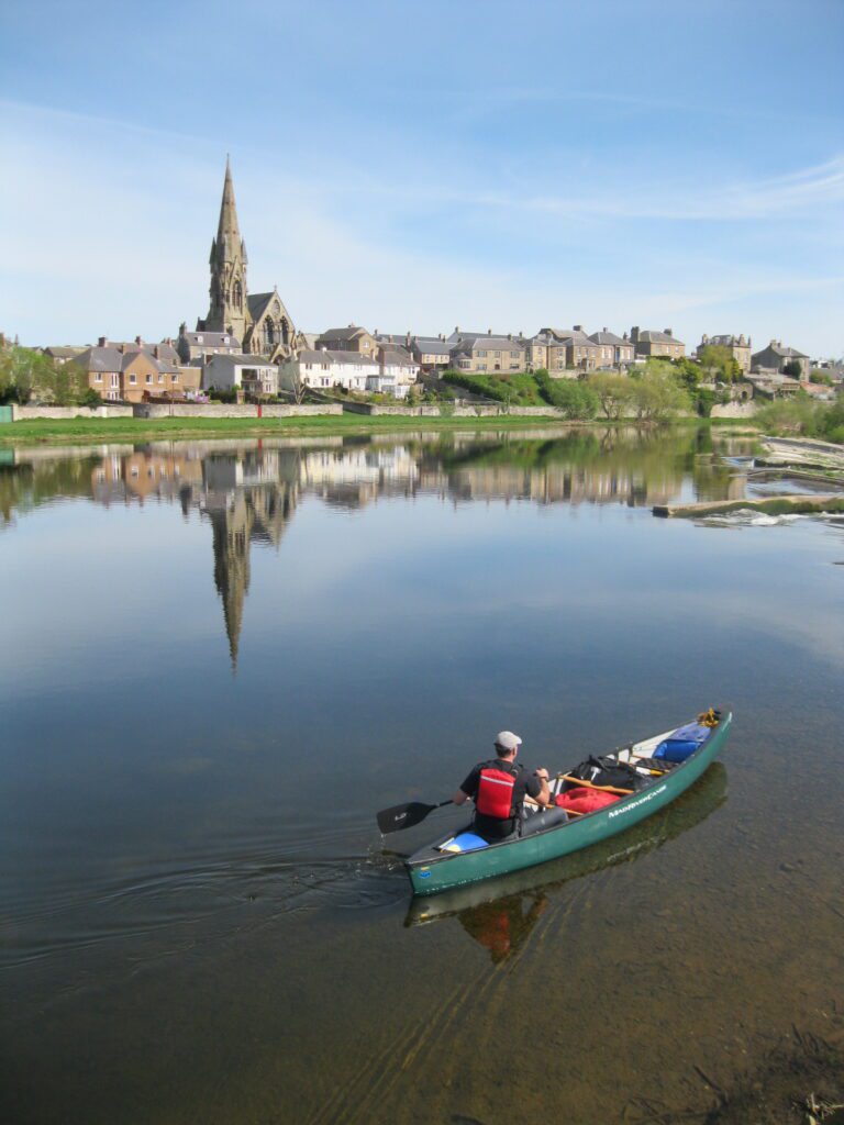 Cory paddles the tweed with kelso in background